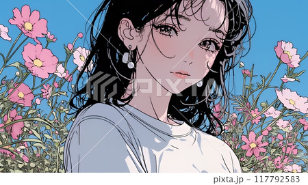 コスモス畑にいる若い女性