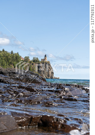 A beautiful view of Split Rock Lighthouse on the rocky coast of Lake Superior. 117792811
