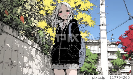 紅葉の秋の街を歩く若い女性
