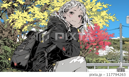紅葉の秋の街を歩く若い女性