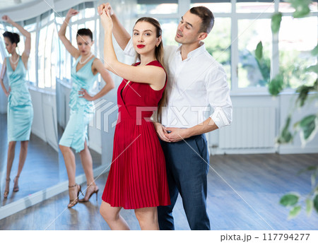 Elegant couple rehearsing sensual wedding dance in studio 117794277