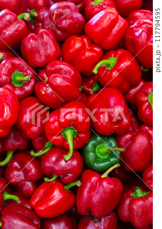 Closeup of ripe red bell peppers 117794595