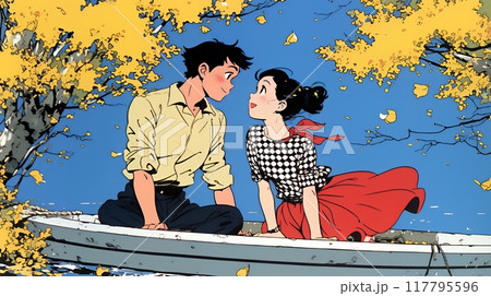紅葉の湖でボートに乗っている若いカップル