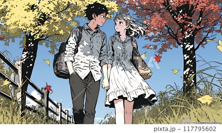 紅葉の小径を歩く若いカップル