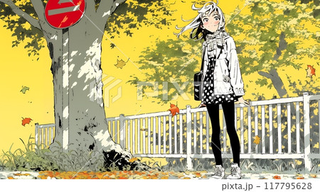 紅葉の小径を歩く若い女性