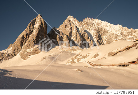 Beautiful view of Jade Dragon Snow Mountain (or Mt.Yulong) during sunrise. This mountains located in Yulong Naxi Autonomous County, Lijiang, in Yunnan province, China. Beautiful view of Jade Dragon Snow Mountain (or Mt.Yulong) during sunrise. This mountains located in Yulong Naxi Autonomous County, Lijiang, in Yunnan province, China. 117795951