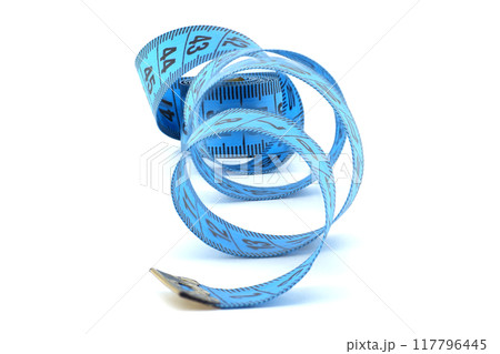 Blue measuring tape coiled on a white background representing precision, fitness, and tailoring Blue measuring tape coiled on a white background representing precision, fitness, and tailoring 117796445