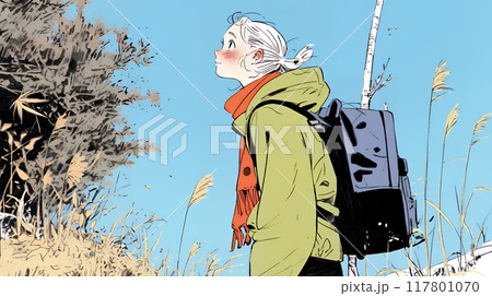 秋の野山をハイキングしている若い女性