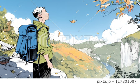 秋の野山をハイキングしている若い男性