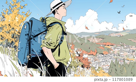 秋の野山をハイキングしている若い男性