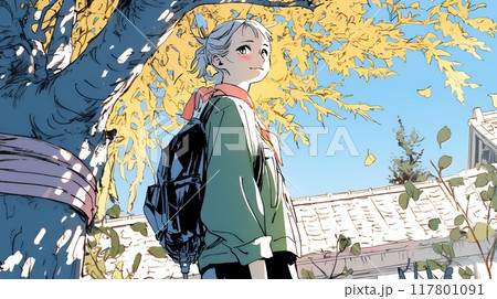 街の木々の紅葉と若い女性