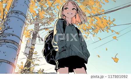 街の木々の紅葉と若い女性