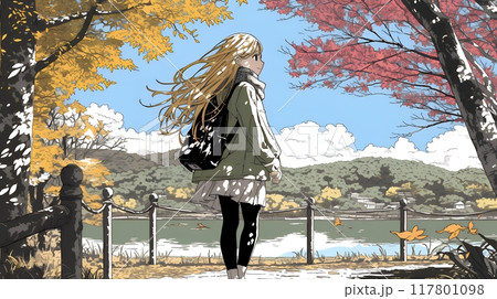 水辺の紅葉の小径を散策している若い女性