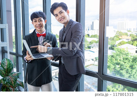 Company executive Young Asian businessman and coaching personal secretary assistant Homosexual businessman LGBT  partners while working together with laptop computer and strategy in business in office 117801315