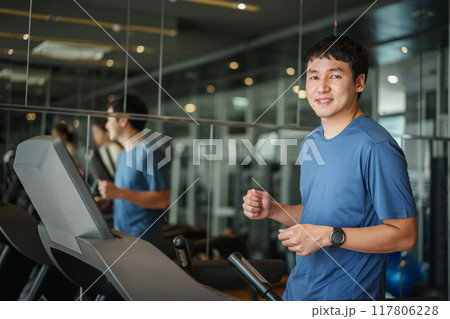 man running on treadmill at fitness gym exercise 117806228