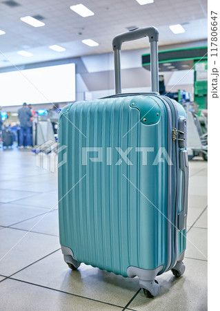 Suitcase or baggage with airport luggage trolley in the international airport, focus on suitcases. Vacation concept 117806647