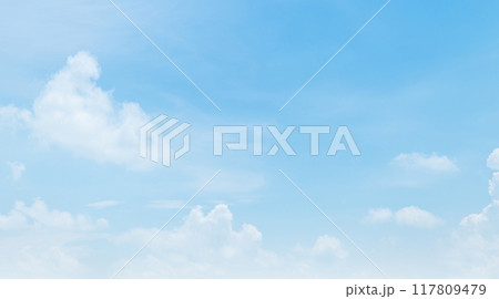 clear blue sky with a few clouds 117809479