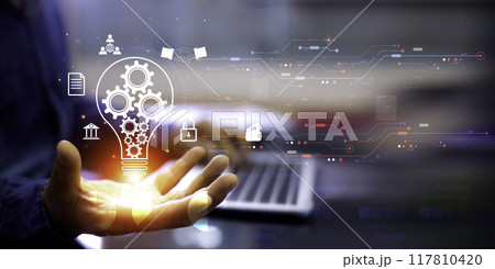 Businessman Touching Icon Bulb.Concept of Ideas for success.Concept with innovation inspiration.Success start from new ideas to innovative technology relying on information from the internet big data. 117810420