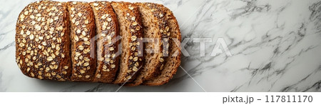 Freshly Baked Multigrain Bread Loaf Sliced on Marble Countertop - Healthy Whole Grain Artisan Bread 117811170