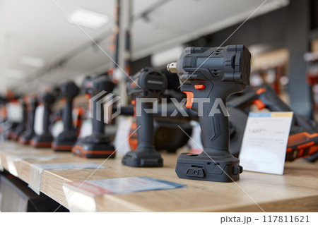 Modern professional impact drill power tool on display at hardware store Modern professional impact drill power tool on display at hardware store 117811621