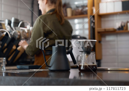 Front view on manual equipment for coffee preparation on table 117811723