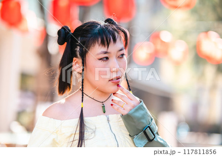Portrait of an Asian woman against the background of Chinese lanterns.  117811856