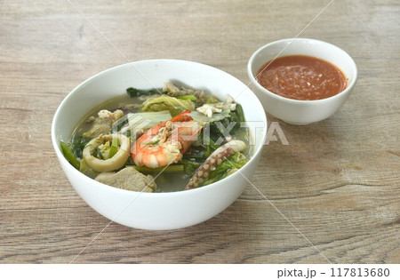 boiled sukiyaki seafood chicken and pork meat couple crispy pickled squid and shrimp with vegetable in soup on bowl dipping sauce 117813680