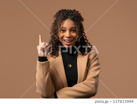 Breakthrough creative idea, african teenager girl has eureka, pointing finger up 117813994