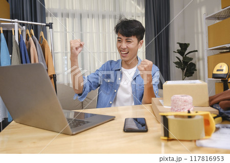 Young successful business man happy after new order from customer 117816953