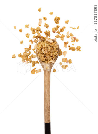 crunchy granola in wooden spoon isolated on white 117817895