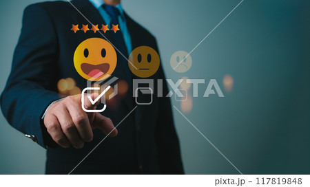 Businessman give excellent five-star ratings, Customer experience concept. Customers give excellent five-star ratings with smiley face emoticons for service, Satisfaction, Reviews, Feedback. 117819848