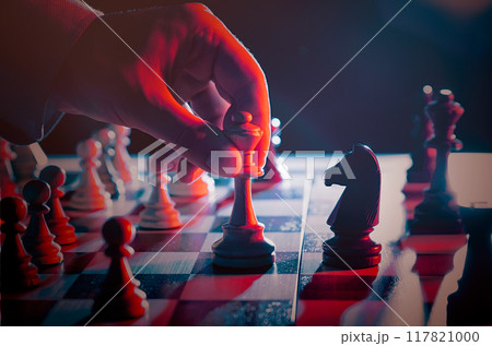 Businessman planning strategy with chess figures Businessman planning strategy with chess figures 117821000
