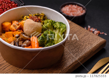 Colorful vegan vegetarian dish consists of tofu, broccoli, quinoa, mushrooms 117825333