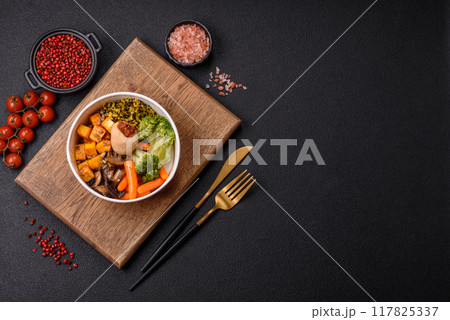 Colorful vegan vegetarian dish consists of tofu, broccoli, quinoa, mushrooms Colorful vegan vegetarian dish consists of tofu, broccoli, quinoa, mushrooms 117825337