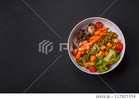 Colorful vegan vegetarian dish consists of tofu, broccoli, quinoa, mushrooms 117825354
