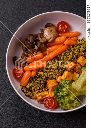 Colorful vegan vegetarian dish consists of tofu, broccoli, quinoa, mushrooms 117825418