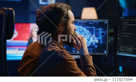 Computer scientist writes code on PC to visualize artificial intelligence neural networks. Remote IT worker runs AI script for information processing from personal office, camera A Computer scientist writes code on PC to visualize artificial intelligence neural networks. Remote IT worker runs AI script for information processing from personal office, camera A 117827094