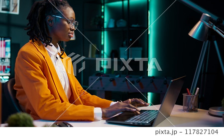 Student reviewing course materials and lecture notes before entering virtual web classroom, business administration courses. Pupil learning to interpret data using spreadsheets. Camera B. 117827104