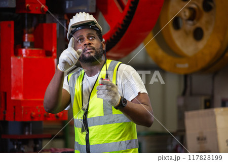 Male African American engineer holding walkie talkie quality control 117828199