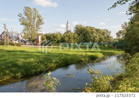 River with green lawn in russian town of Nerekhta 117828372