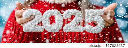 Woman holding 2025 year number close up signifying new year, Christmas and future concepts Woman holding 2025 year number close up signifying new year, Christmas and future concepts 117828487