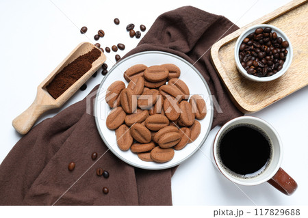 A cup of coffee with cookies on a white background A cup of coffee with cookies on a white background 117829688