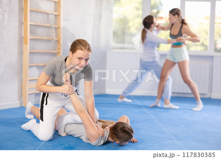 Females practicing self defence moves Females practicing self defence moves 117830385