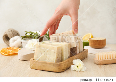 Natural handmade soap with ingredients, on a light background. 117834024