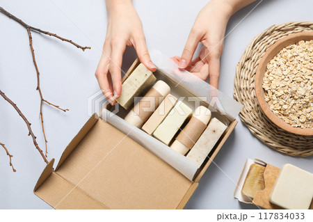 Natural handmade soap with ingredients, on a light background. 117834033