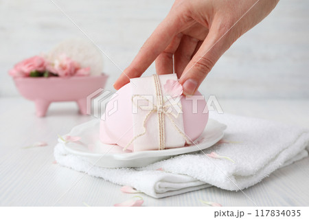 Natural handmade soap with ingredients, on a light background. Natural handmade soap with ingredients, on a light background. 117834035