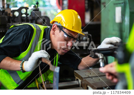 Operational level employees worker man wearing uniform safety and hardhat working machine Operational level employees worker man wearing uniform safety and hardhat working machine 117834409