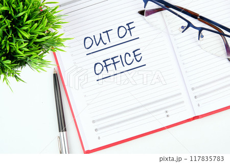 OUT OF OFFICE words written in the business notebook OUT OF OFFICE words written in the business notebook 117835783