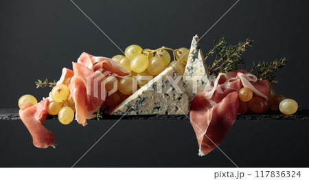 Grapes with blue cheese, prosciutto and thyme. 117836324