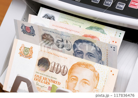Singapore dollar in the counting machine 117836476